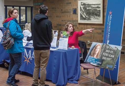 Grad helps out at Open House