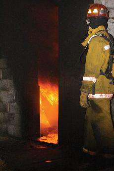 Fire Protection student evaluating the scene at Live Fire Attack training scenario on November 20.