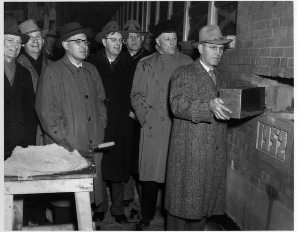 Technology dictates expansion - School and city officials insert a time capsule within the cornerstone during dedication ceremonies for the  T Building at the corner of 6th St. and Highland Ave. The popular socialist mayor, Carl Zeidler, is pictured in th
