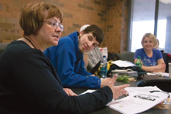 Student Senator, Vlad Shteyn (center) and Senate President, Angela Olson (R) attentively listen as Cathy Lechmaier helps student Senate  members with their agenda at the recent meeting at Oak Creek. Lechmaier is well liked for her dedication as Student Li