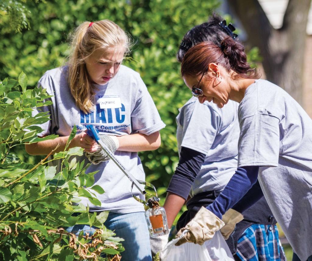 Faculty members and students work together to collect trash around Hillside Terrace Family Resource Center on Saturday, September 14 for the first annual MATC Day of Service.