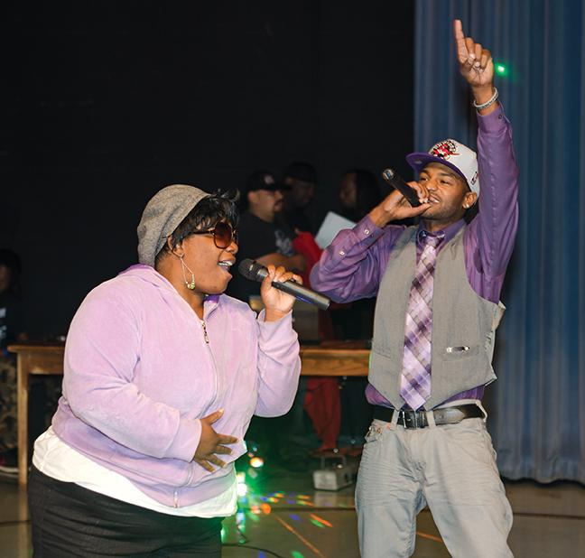 Jackie B performs with Anfernee McDowell to sing an original song he wrote, “Black Girl Lost,” at the talent show. 