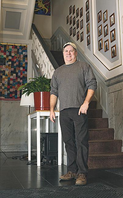 Jim Rauth stands in the entryway to the Grand Avenue Club. The Grand Avenue Club is the where Rauth drew his inspiration to write his book, “What Color Is Your Brain Scan?” He is currently enrolled in the human services program at MATC.