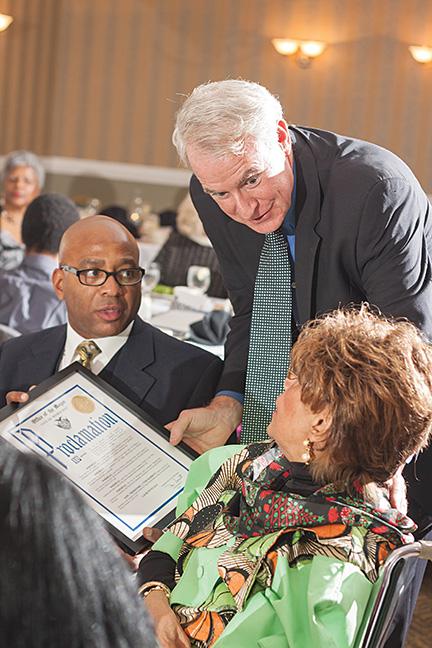 Mayor Tom Barrett presents Lauri Wynn with a framed proclamation for her accomplishments at the Community Brainstorming Conference on Nov. 15.