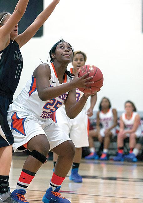 Ashley McHenry (25) drives down the court during a recent game against the Rochester Yellowjackets. The women won 97-66.