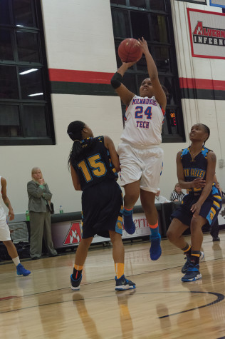 Benetta Jones (#24) breaks through the defense and shoots for two.
