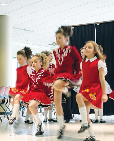 Irish dancers entertain the audience with their stunning choreography.