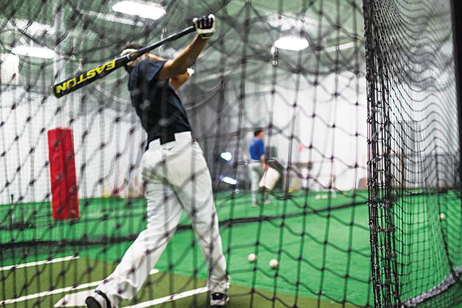 One of the players from the Stormers practices hitting home runs in preparation for the start of the season.