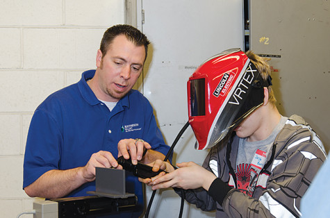 Hold it right there. High school students test their welding capabilities with Robert Koltz (ESAB Welding) at the Heavy Metal Tour, MATC Oak Creek Campus on March 18. 