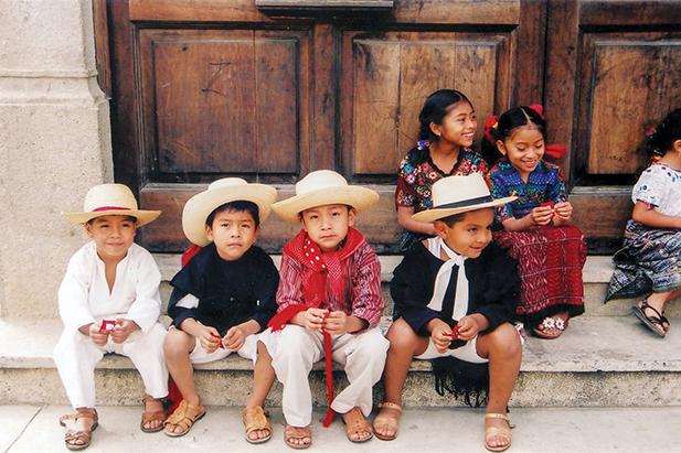 Students wait for visitors to arrive at a school in Aguas Calientes near Antigua in Guatemala. 