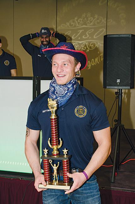 Mike Hiller/Times
Criminal Justice program student, Devin Dettmann, proudly holds his trophy from the 2014 Chili Cookoff.