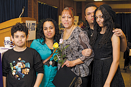 Evette A. Cruz with her children after the induction into both Phi Theta Kappa and National Technical Honor Society. Going on 50 years of age, Cruz says she feels like a role model to her children.
