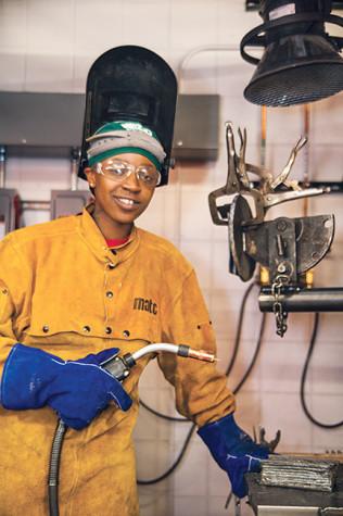 Regina Allen, Preparatory Plumbing program student, not only knows how to weld but her other interests include history, reading poetry by Maya Angelou and singing in her church choir.