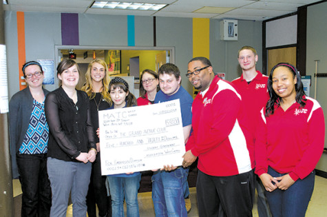 West Campus Student Government donates to Grand Avenue Club