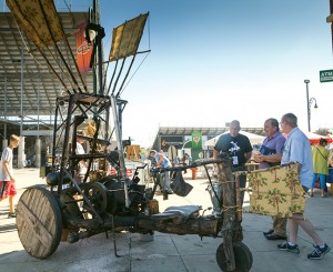 Steve Hay, inventor, builder, flyer and demonstrator, explains the flying machine exhibit.