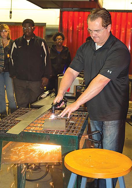Jeff Ellingson, from local company Hypertherm, participates in the Heavy Metal event.