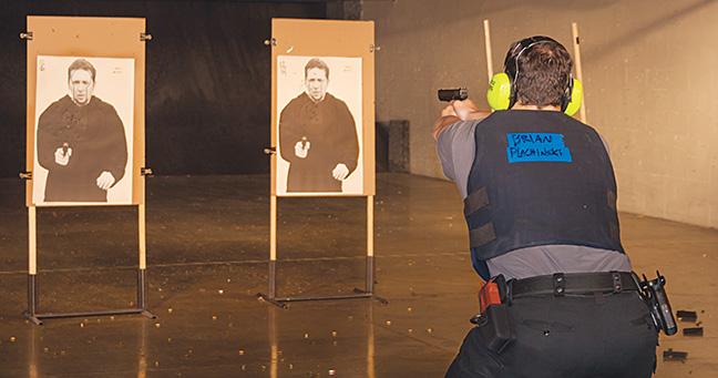 Criminal Justice/Law Enforcement program student Brian Plachinski takes target practice at the Oak Creek campus firing range.