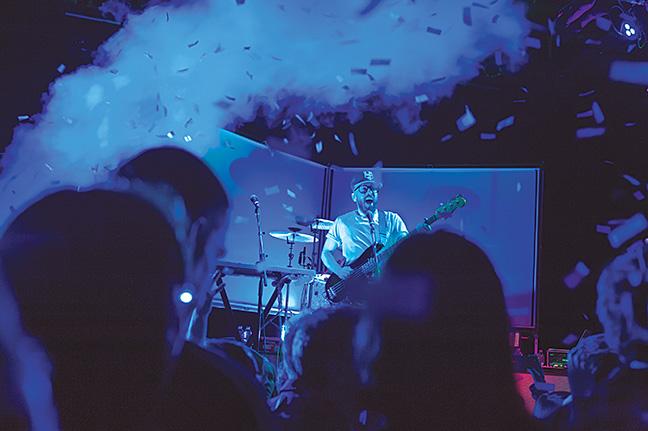 Bassist Tim Nordwind from Ok Go gets the crowd going at a recent concert at Turner Hall Ballroom. Nordwind was inspired by his grandfather.