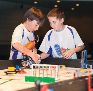 Kenosha LEGO Masters’ Elliot Rodriguez and Troy Limbaugh anxiously put their robot through the course during the performance round.