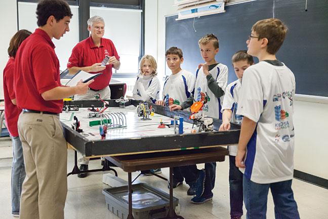 Kenosha LEGO Masters’ Sean Robinson, Elliot Rodrigues, Ben Wirch, Troy Limbaugh and Ethan Powers demonstrate how their robot works and answer questions from the judges in the Robot Room.