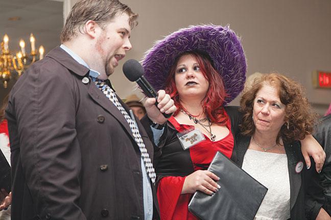 Prime suspects Rebecca Lechmaier and Theresa DAmato in the murder of magician The Great Scott are being interrogated by the detective at the Murder Mystery Dinner held on Oct. 31 at Klemmers Banquet Center in Milwaukee.