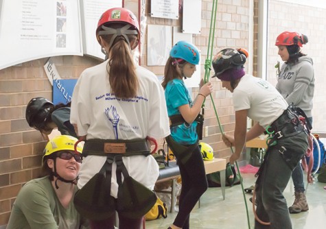 Girl Scouts get hooked up for a climb as part of the landscape horticulture program.
