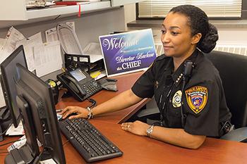 Director of Public Safety, Chief Aisha Barkow, sits at her desk at the Main Building at the Downtown Milwaukee campus. 
(This is a photo from the MATC archive. It was taken in 2015.)