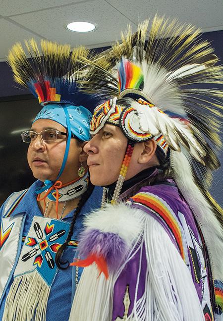 Ronnie Preston (left) and brother Daniel Preston (right) of the San Carlos Apache Tribe, display their regalia for the students of the West Allis campus during their Native American dance demonstration.