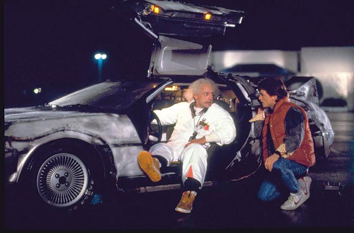 Inventor Emmett Doc Brown, played by actor Christopher Lloyd, left, and Marty McFly, played by Michael J. Fox, prepare for the first test of the Docs time machine in a shopping mall parking lot in the 1985 film Back to the Future. (Photo courtesy Universal Studios/TNS)