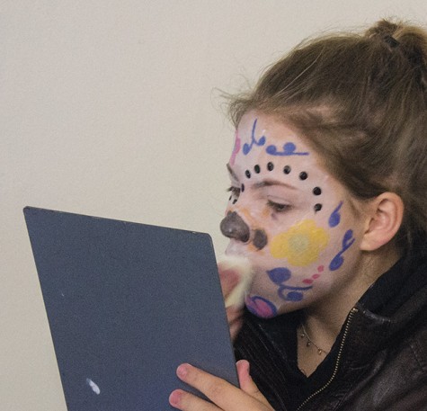 Koryn Warren of West Allis applies her “Muertos” makeup.