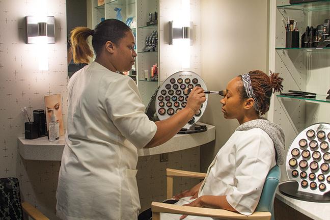 Erika Bonner demonstrates how to put mineral makeup on Brittney Payne’s face. Bonner and Payne are Aesthetician students. Skyn is located in Room A233 at the Mequon campus.