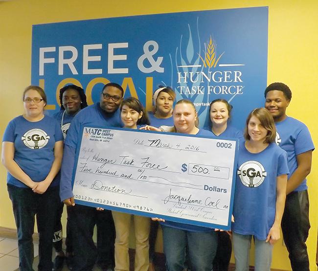 West Allis Campus Student Government members and volunteers (L-R) Kati Huisheere; Benita Oatis; Jarvis Harmon; Jacquelinne Coel, president West Campus SGA; Amber Joshway; Jamie Lassa; Angela Amborn; Irina Javorek; and Willie Robinson proudly presented a check for a donation to the Hunger Task Force, which was matched, bringing the total donation to $1,000.