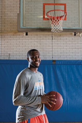 Basketball star Thomas Hood dribbles on