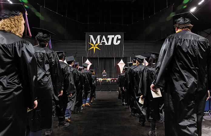 MATC+graduates+make+their+way+to+their+seats+in+UW-Milwaukee+Panther+Arena+during+the+college%E2%80%99s+winter+commencement+ceremony+on+Dec.+16.