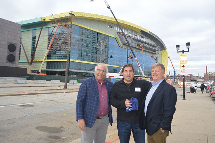 Mark Kass, former president of the Milwaukee Press Club; Peter Feign, Milwaukee Bucks president; and Jim Nelson of the Milwaukee Journal Sentinel, pose in front of the new Bucks arena under construction.