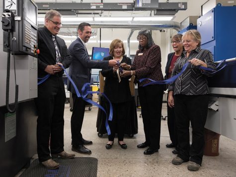 Corey B. Johnson, (second from left) president of Morris Midwest, Dr. Vicki Martin (third from the left) MATC president, and Dorothy Walker, interim dean of MATC’s School of Technical and Applied Sciences, cut the ribbon on the college’s new CNC Swiss lab on Oct. 17 at the Downtown Milwaukee Campus.