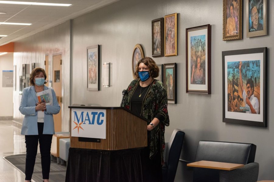 Community At Committee Chairperson Julie Ashlock, Ed.D., gives remarks a the collections unveiling as President Vicki Martin, Ph.D., looks on.