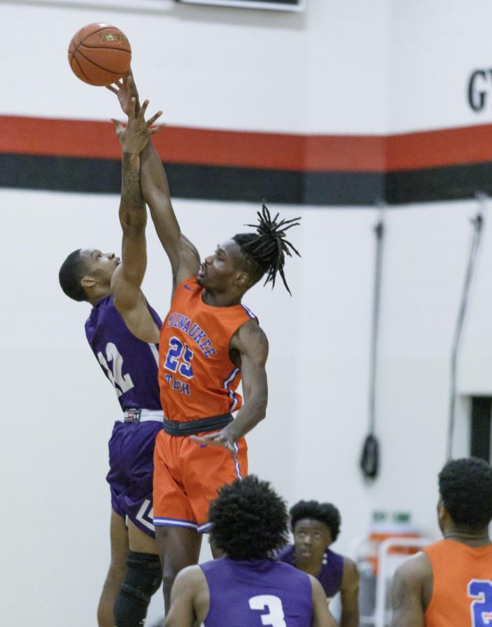 Stormers 66 forward Mason Johnson wins the jump ball against the Wolves 63 guard Kyle Jackson in Thursday nights final home game.