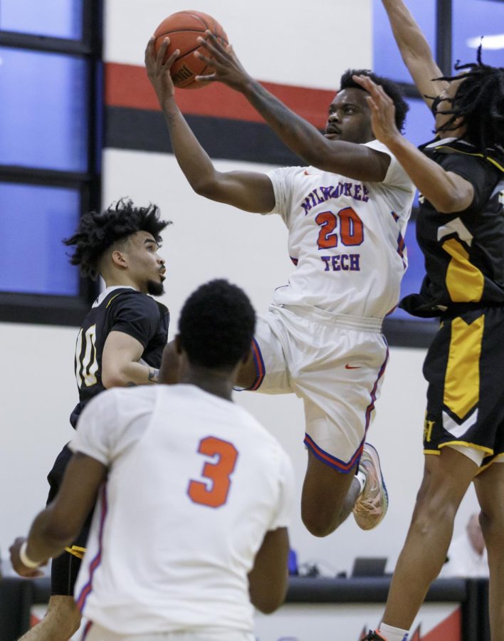 Stormers forward Karl Blanton Jr. appears to float in the air as he scores against the Black Hawk College Braves in the Regional Championship game.  