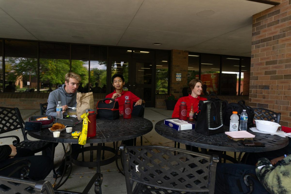 Oak Creek's EMT students enjoying lunch on the patio located outside the Cyber Café on a Monday in September.