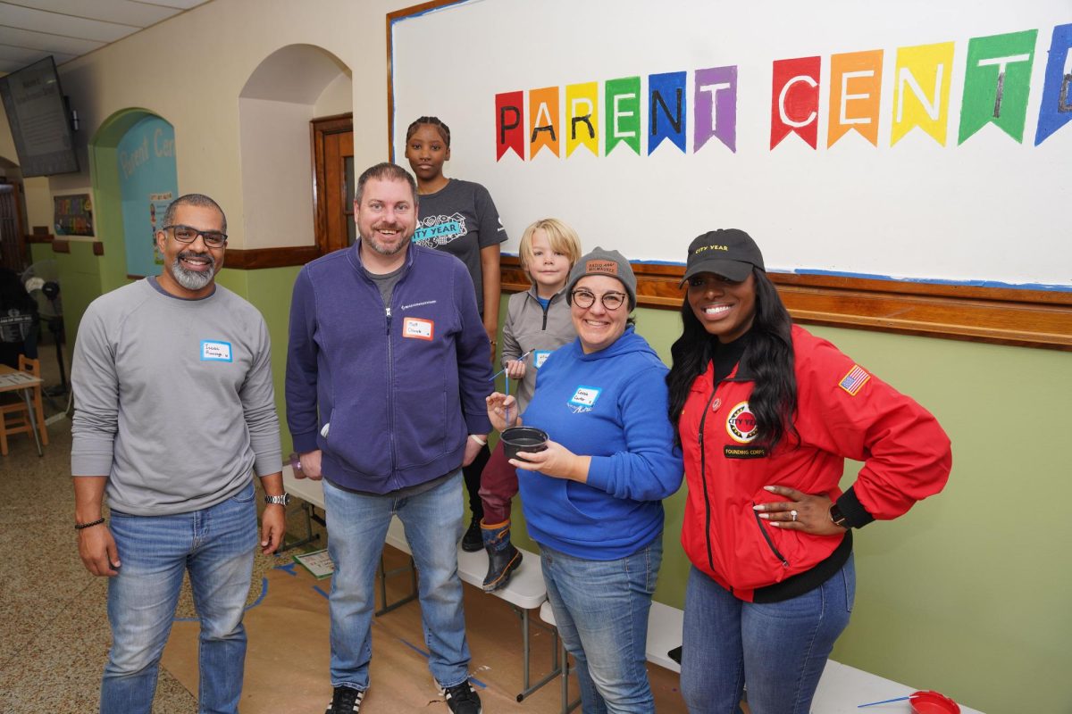 Volunteers take a break from serving to pose during City Year Milwaukee’s Dr Martin Luther King, Jr. Day of Service on January 15.