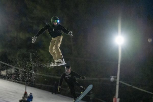 A snowboarder shows some air at the Big Air for Care fundraiser at Little Switzerland Ski Hill in Slinger.