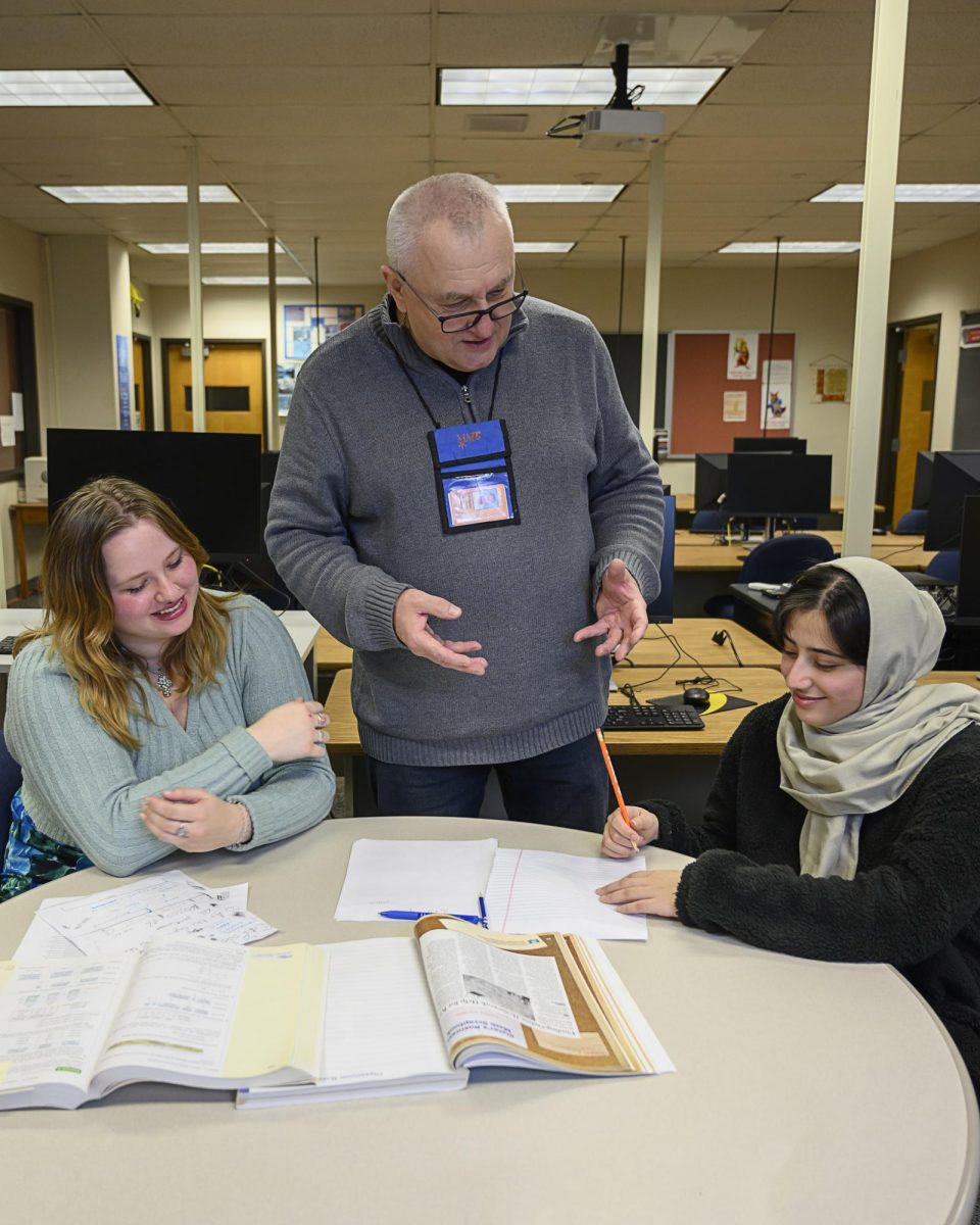 Math Instructor Volodymyr Opryshchenko (known by students as Mr. O.) helps Georgia Makal (L) and Maryam Huwail (R) with math assignments at the Math Success Lab in the C Building at MATC’s Downtown Campus. 