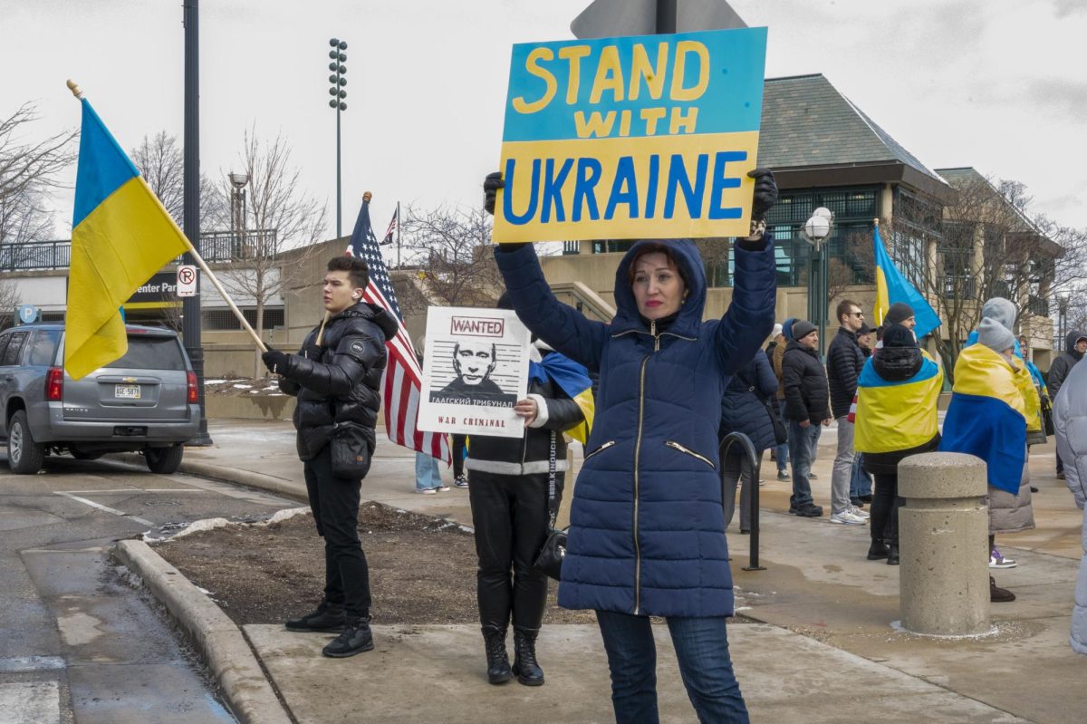 A woman holds a sign at rally for Ukraine in Milwaukee on Saturday, February 24.