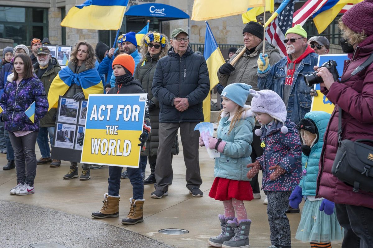 Children hold signs to commemorate the two year anniversary of the war in Ukraine in downtown Milwaukee on Saturday. 