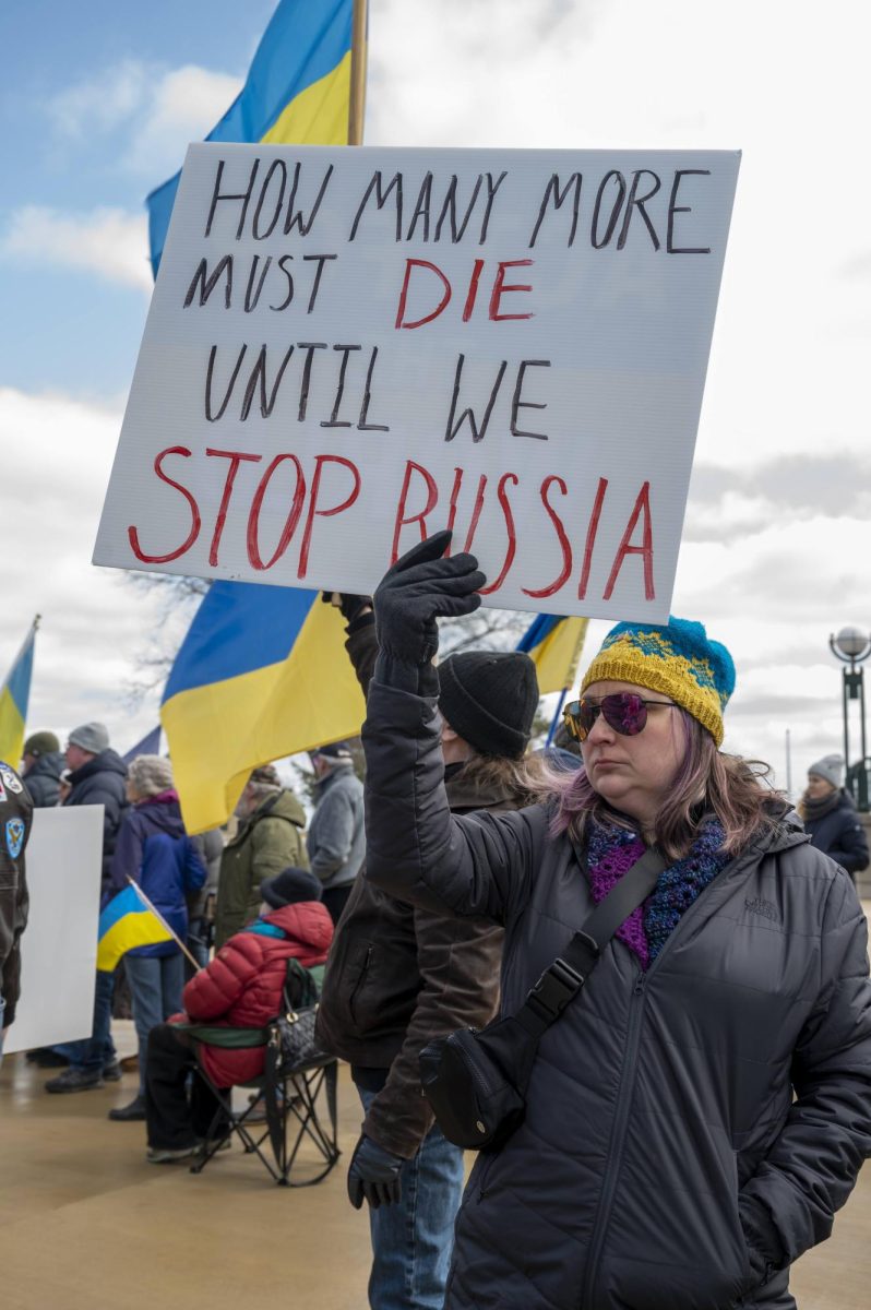A woman holds a sign at a rally for Ukraine in Milwaukee on Saturday, February 24.