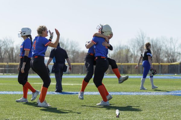 Chloe Sodowski celebrates a win of 9-8 with teammates in the first game against Blue Knights at the Oak Creek field, April 13, 2024.