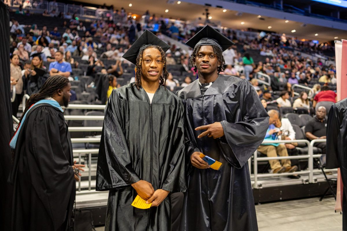 Stormers basketball players Brionne Williams (L) and Shelton Williams-Dryden (R) pose for a photo at MATCs 2024 Spring Commencement ceremony at Fiserv Forum.