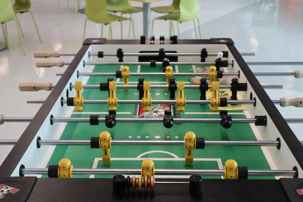 Foosball is one of the games for students to play in the Student Lounge and Rec Center on the third floor of the S Building at the Downtown Campus