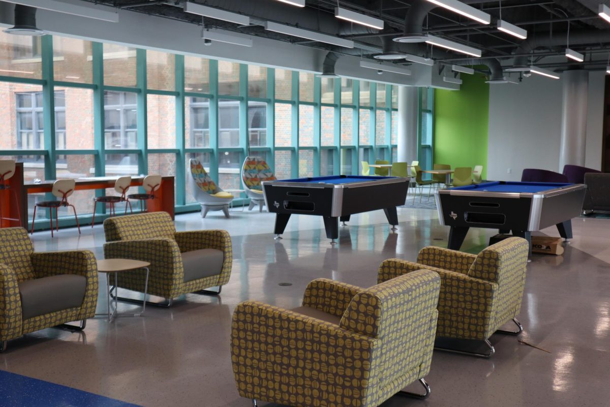 Pool tables, comfy chairs and tables are featured in this section of the Student Lounge and Rec Center on the third floor of the S Building.